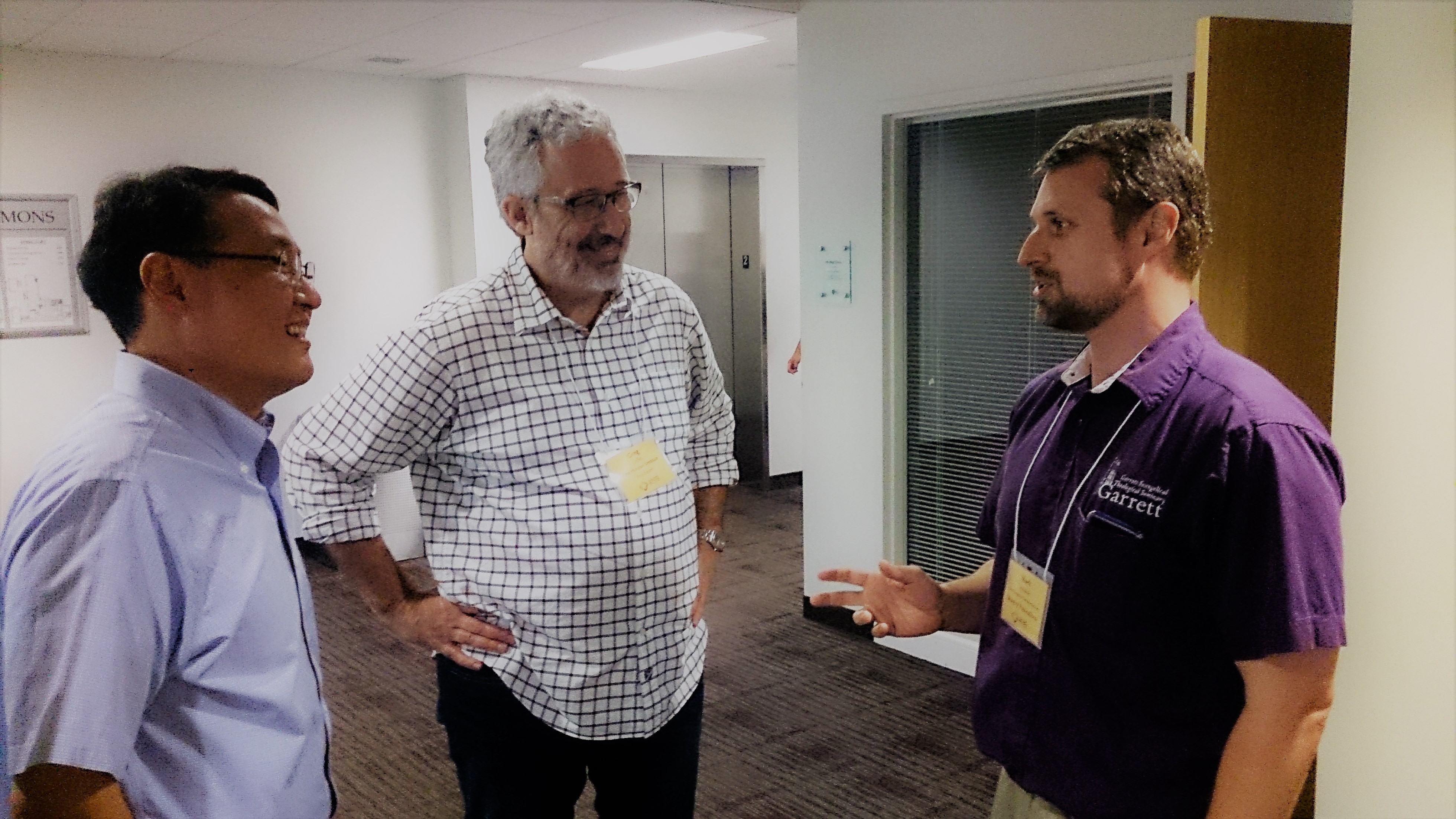 People talking at Annual Meeting